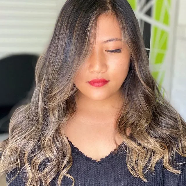 Bronde balayage waves, black top, green wall