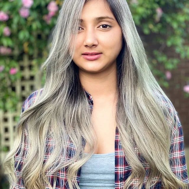 Long ash-silver blended hair, plaid shirt, roses behind